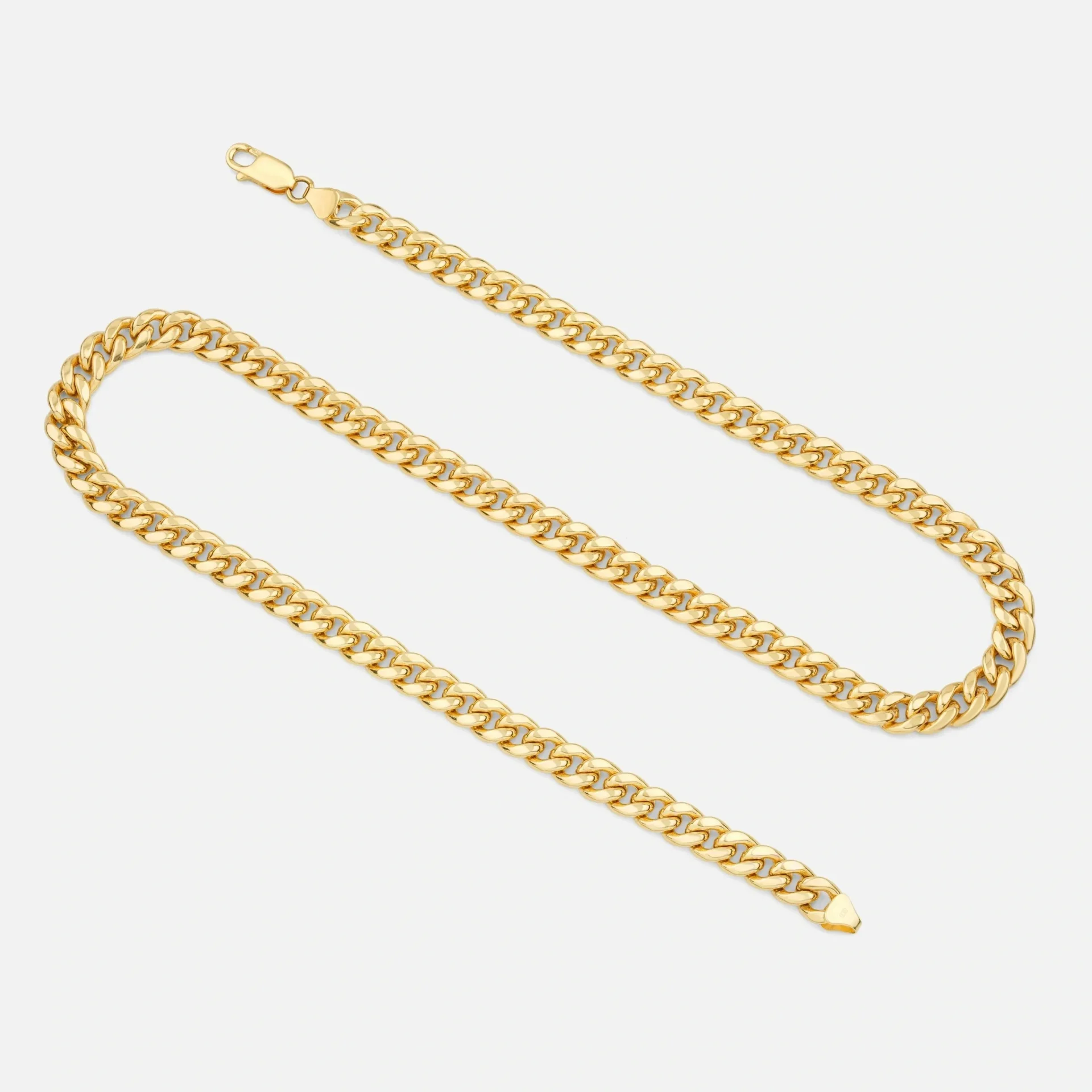 A gold chain is shown with one end missing.